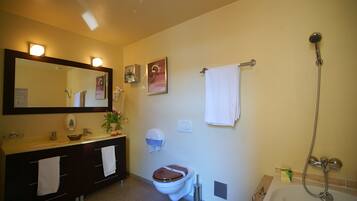 Combined shower/bathtub, deep-soaking bathtub, towels