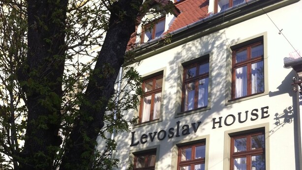 A building with the sign "Levoslav House" indicating it is a hotel. - Levoslav House Villa (Sibiu)