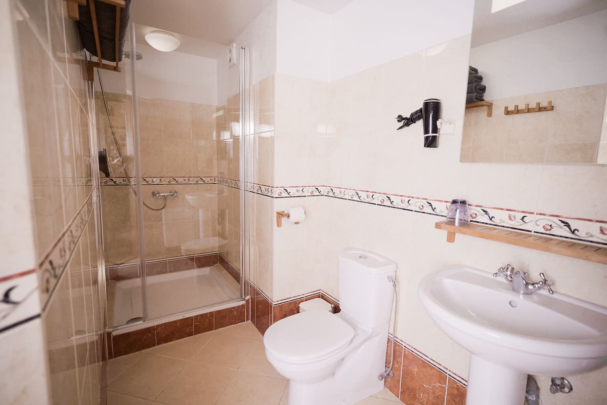family suite, 2 bedrooms, non smoking, garden view | bathroom | free toiletries, hair dryer, slippers, towels