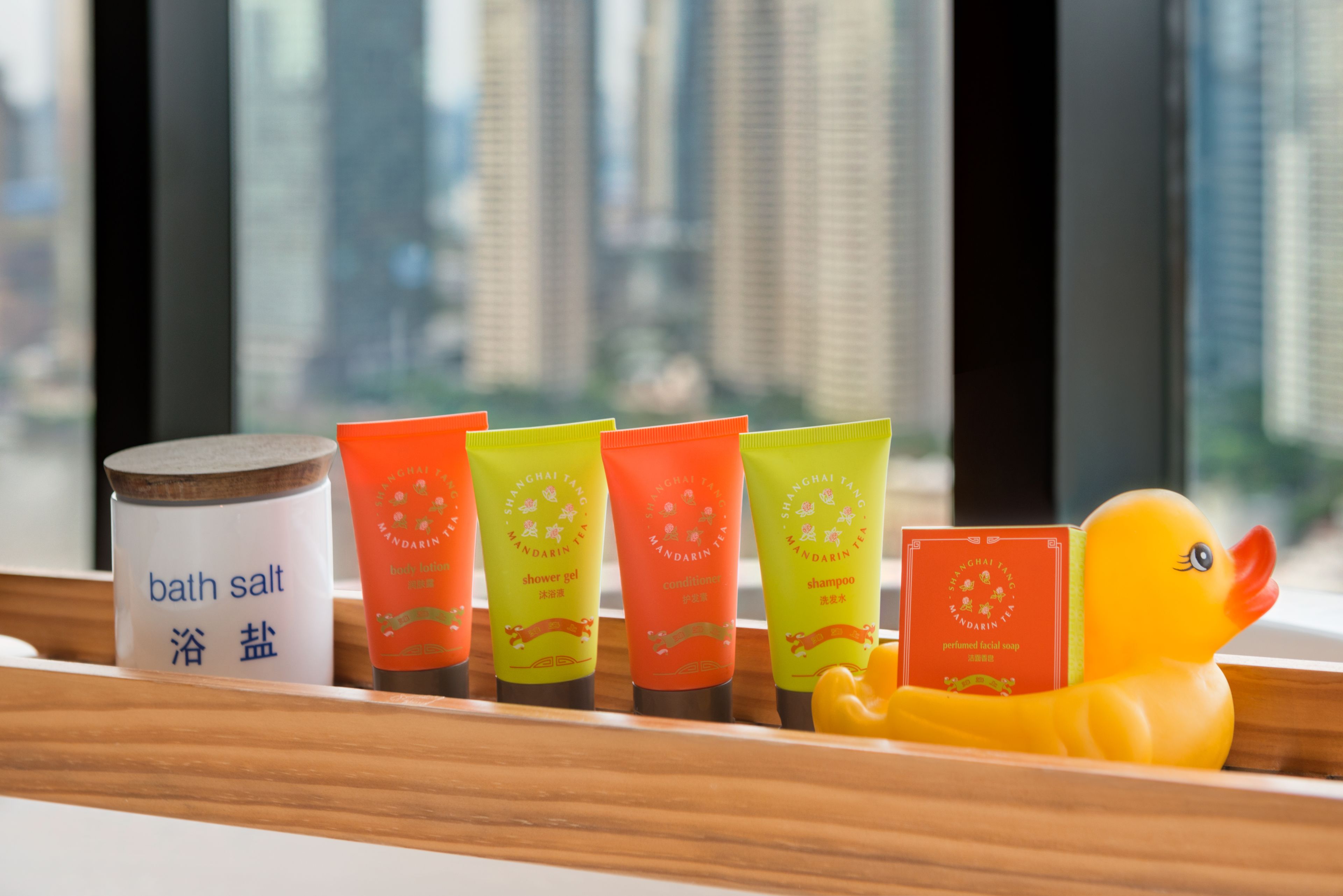 designer toiletries, hair dryer, bathrobes, slippers