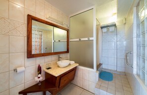 Comfort Room, 1 Queen Bed, Sea View, Poolside | Bathroom | Shower, rainfall showerhead, free toiletries, hair dryer - The Champs (Portsmouth)
