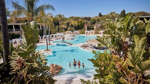 A resort pool area with multiple lounging areas and a central pool. - Forte Village Resort - Il Borgo (Pula)