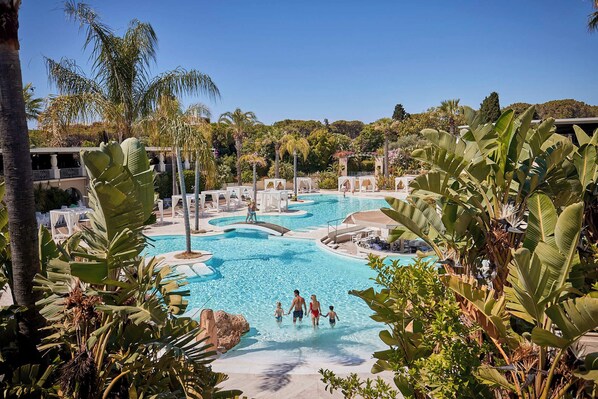 7 outdoor pools, pool umbrellas, pool loungers