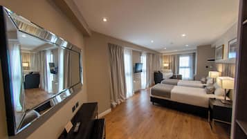 Junior Suite | Minibar, in-room safe, blackout drapes, free WiFi