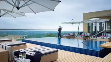 Outdoor pool, pool umbrellas, sun loungers