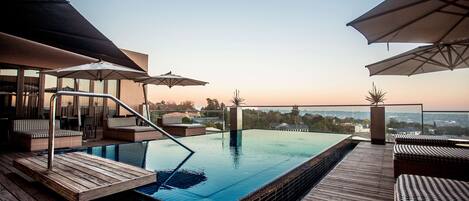 Outdoor pool, pool umbrellas, sun loungers