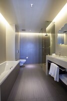 Separate tub and shower, rainfall showerhead, designer toiletries