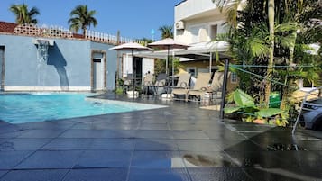Outdoor pool, open 9:00 AM to 9:00 PM, pool umbrellas, sun loungers
