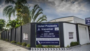 A hotel sign with contact information and amenities.