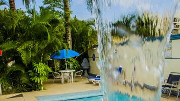Outdoor pool, open 9:00 AM to 9:00 PM, pool umbrellas, pool loungers