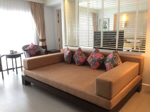 Suite | Living area | Flat-screen TV - Sawaddi Patong Resort & Spa by Tolani (Patong)