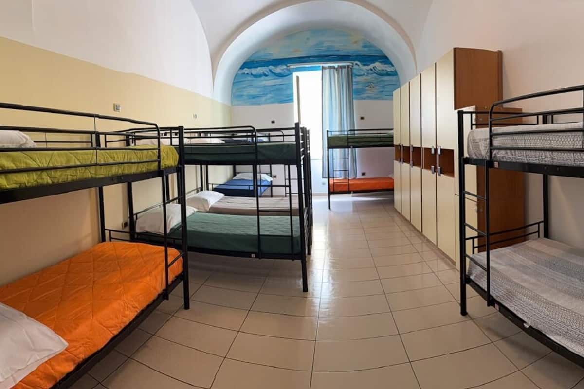 1 bed in Shared Dormitory with external shared bathroom ( 12 pax) | Courtyard view