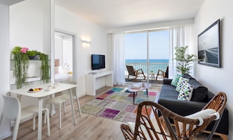 Apartment, 1 Bedroom, Sea View | Living area | Books