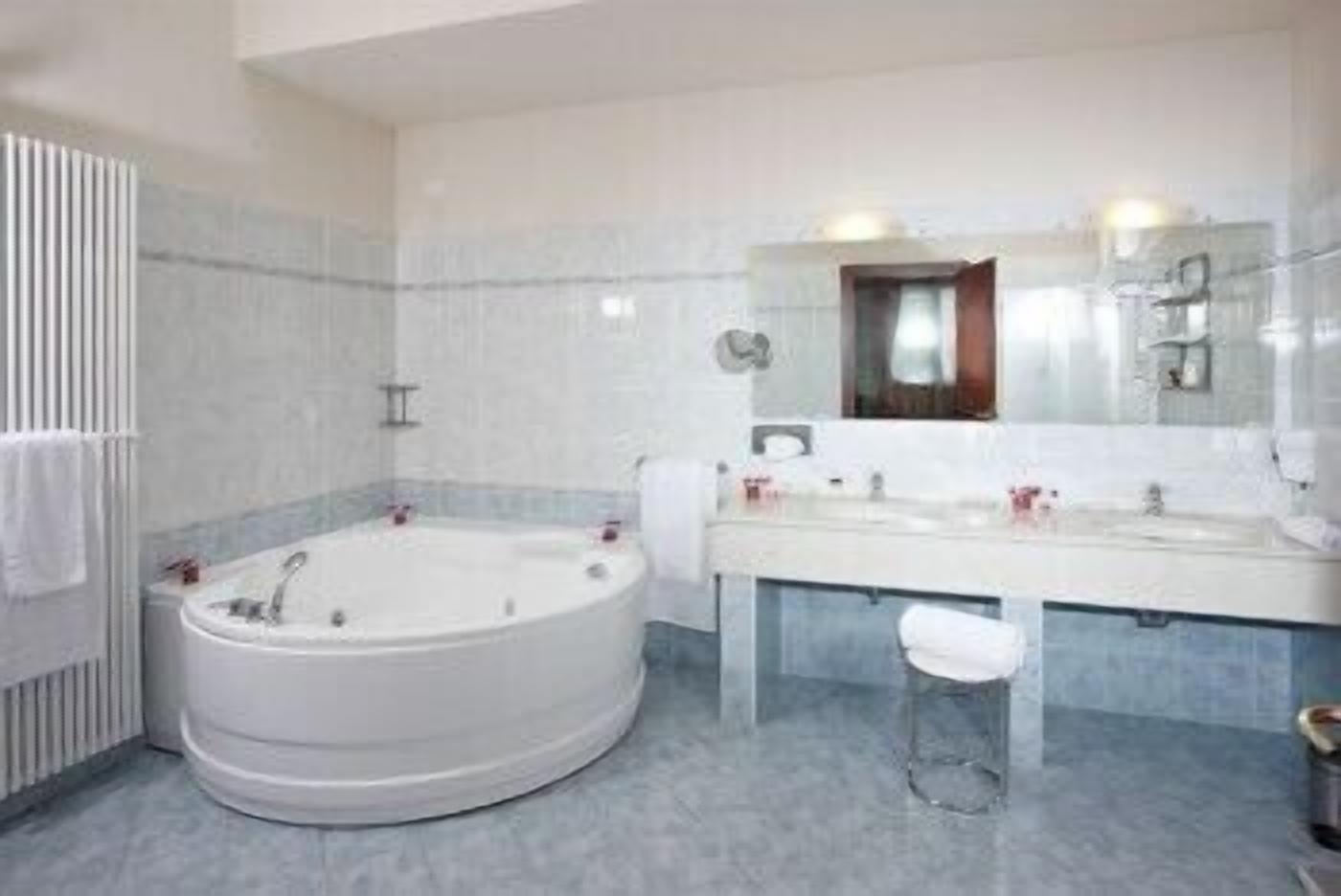 junior suite | bathroom | rainfall showerhead, hair dryer, slippers