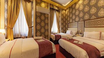 Deluxe Triple Room, 2 Bedrooms, City View | Egyptian cotton sheets, in-room safe, iron/ironing board
