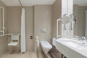 A modern bathroom with a shower, toilet, and sink. - Courtyard by Marriott Basel (Pratteln)