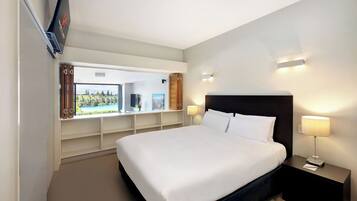 Premium bedding, desk, laptop workspace, soundproofing