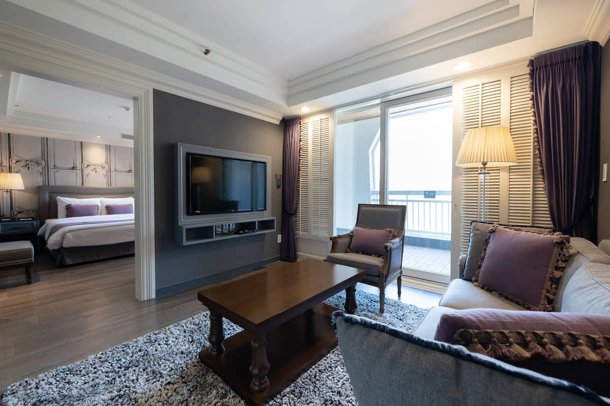 Junior Suite | Living area | 49-inch flat-screen TV with cable channels, TV