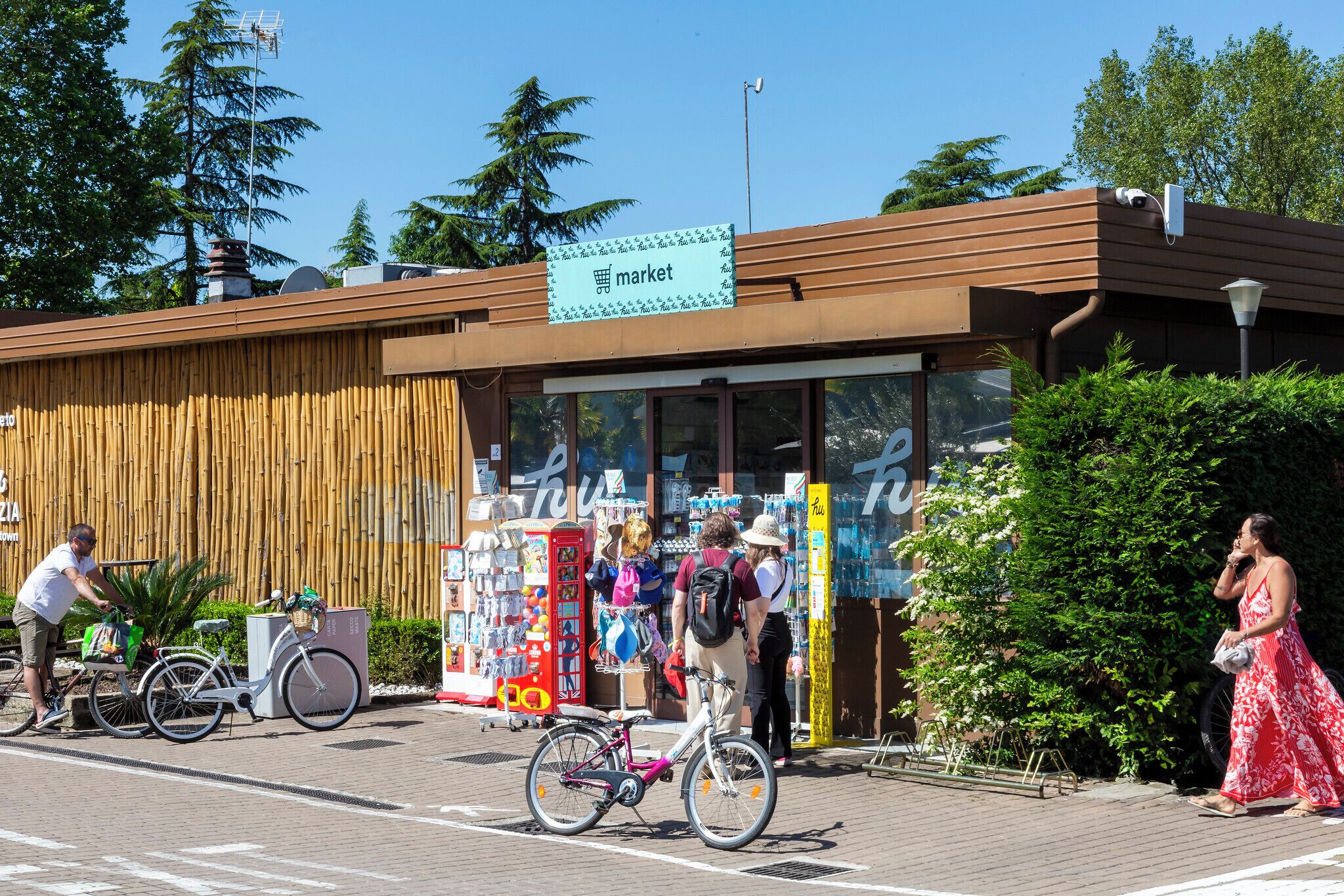 A building with a sign that reads "market" and a bicycle parked in front.