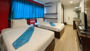 A hotel room with two beds, a TV, a desk, and a bathroom. - Arawana Express Chinatown (Bangkok)