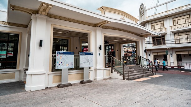 A building with a classical architectural style, featuring a grand entrance with steps and a staircase leading to an upper level. - Arawana Express Chinatown (Bangkok)