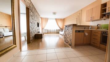Deluxe Apartment, 1 Bedroom | Private kitchen | Full-sized fridge, microwave, coffee/tea maker