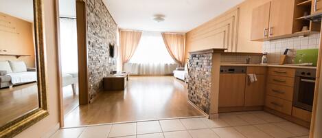 Deluxe Apartment, 1 Bedroom | Private kitchen | Full-size fridge, microwave, coffee/tea maker