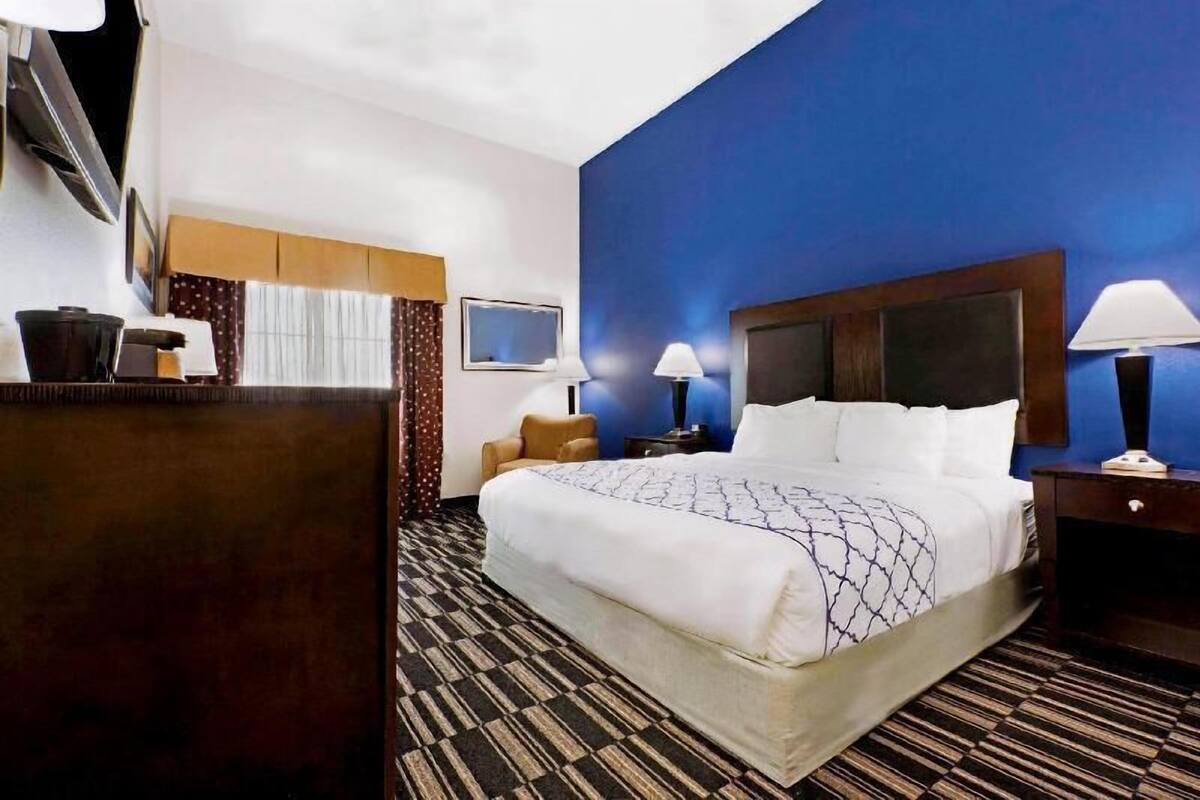 Premium bedding, desk, laptop workspace, blackout curtains