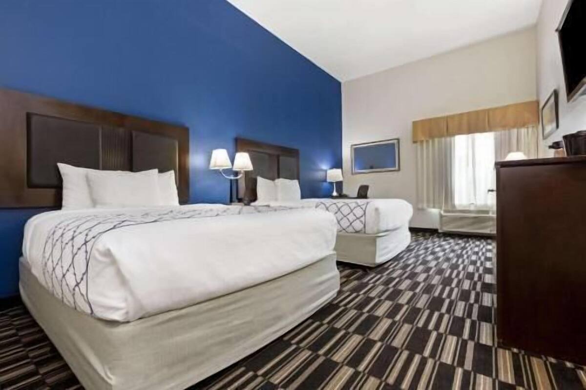 Premium bedding, desk, laptop workspace, blackout curtains