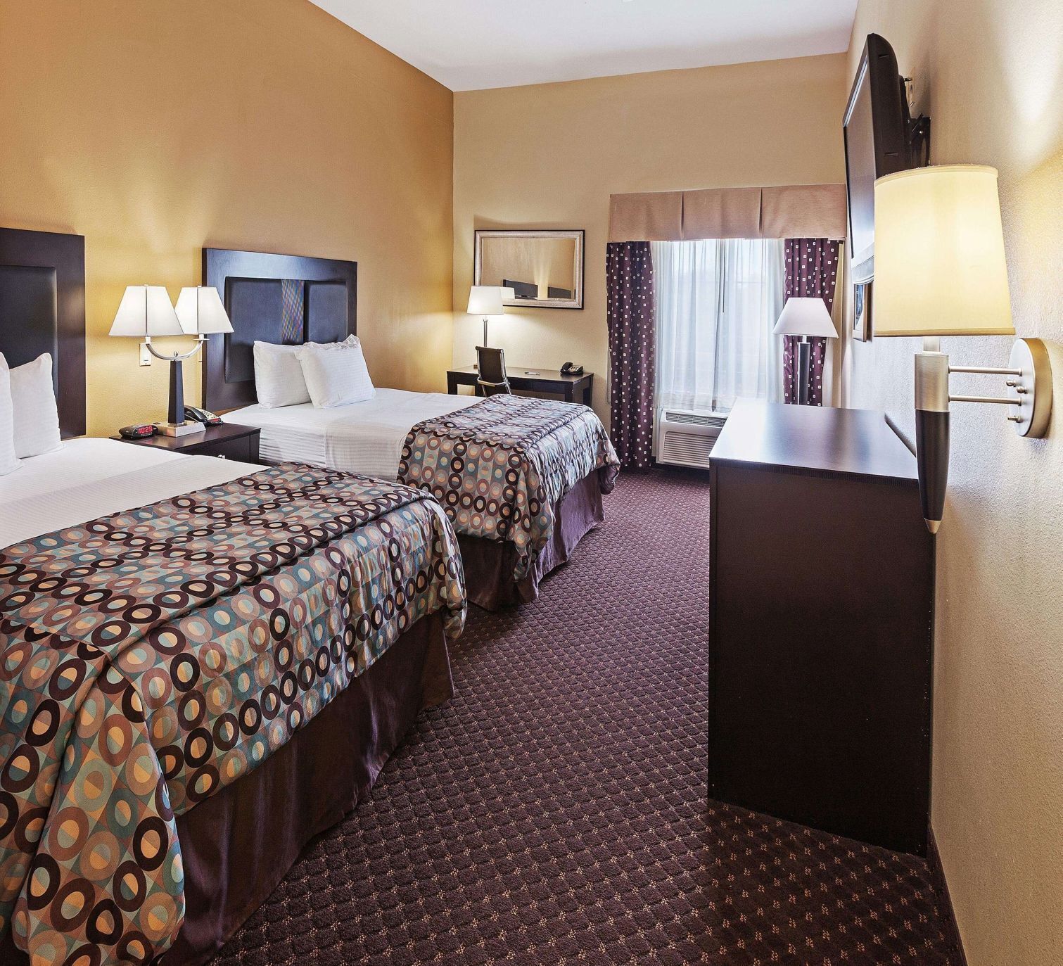 Premium bedding, desk, laptop workspace, blackout curtains