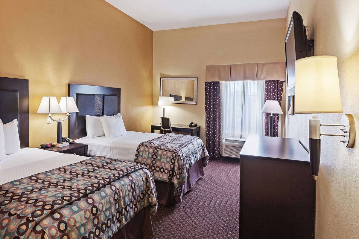 Premium bedding, desk, laptop workspace, blackout curtains