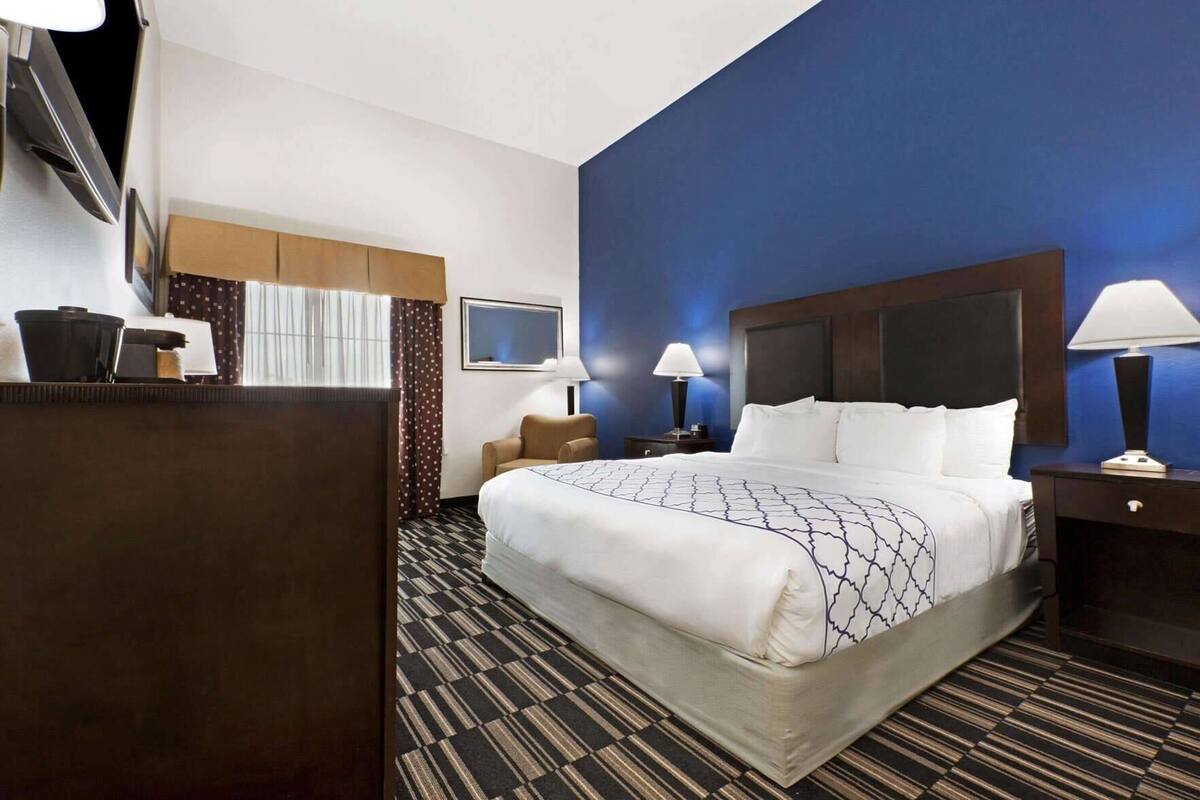 Premium bedding, desk, laptop workspace, blackout curtains