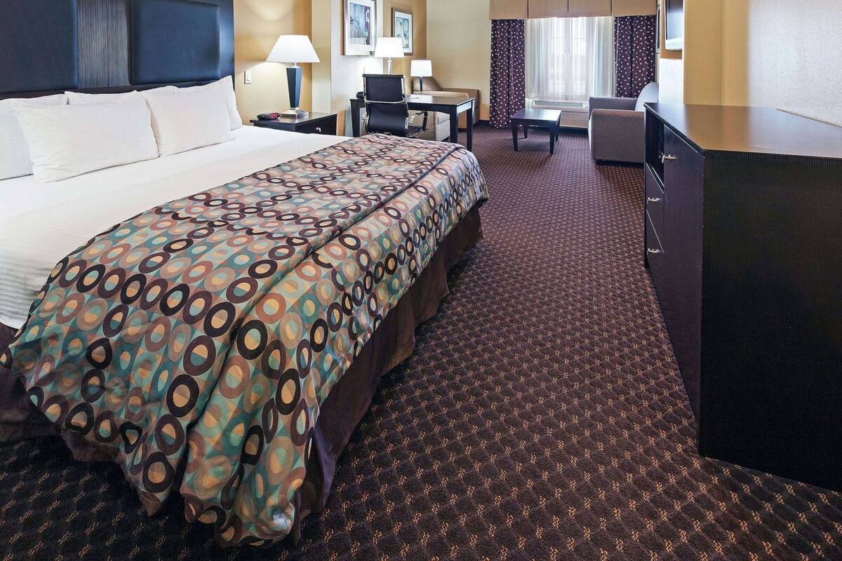 Premium bedding, desk, laptop workspace, blackout curtains
