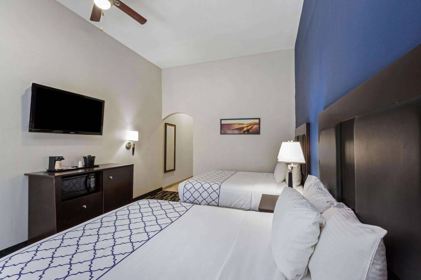 Premium bedding, desk, laptop workspace, blackout curtains