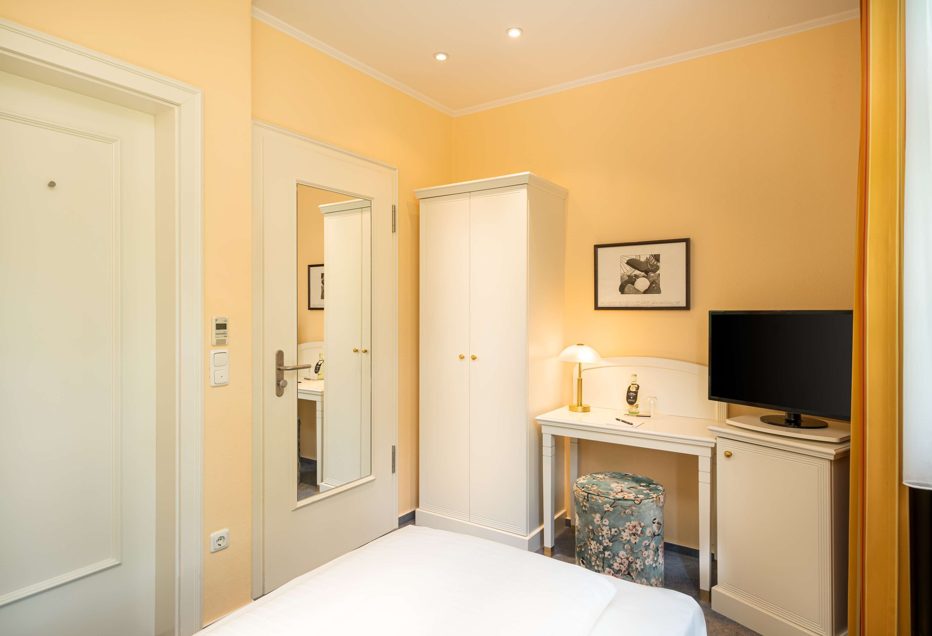 standard single room | individually furnished, blackout curtains, iron/ironing board