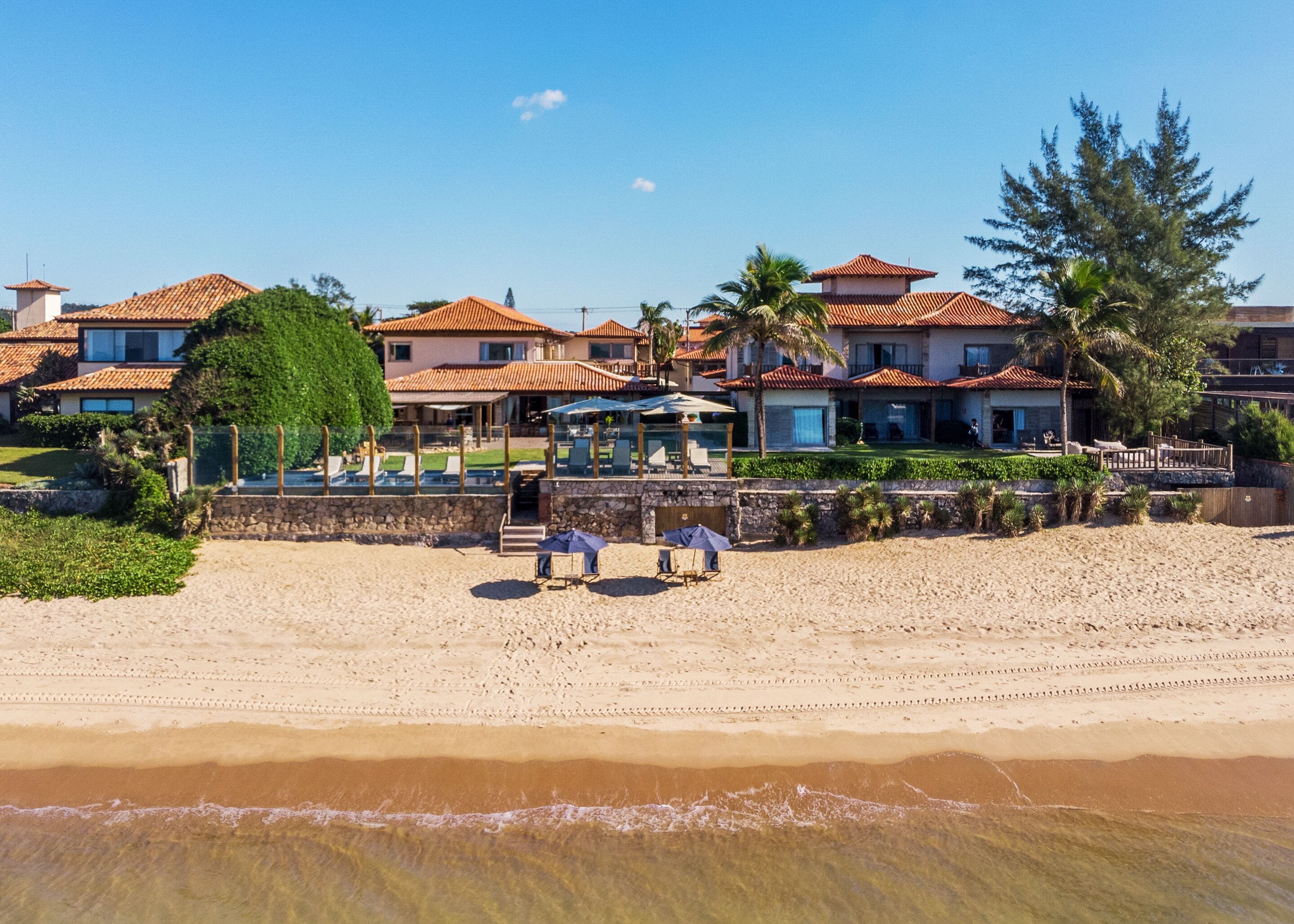 on the beach, white sand, free beach cabanas, sun-loungers