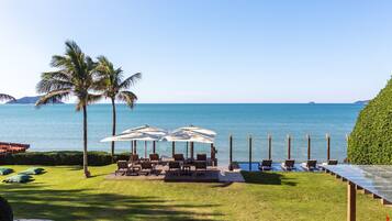 On the beach, white sand, free beach cabanas, sun loungers