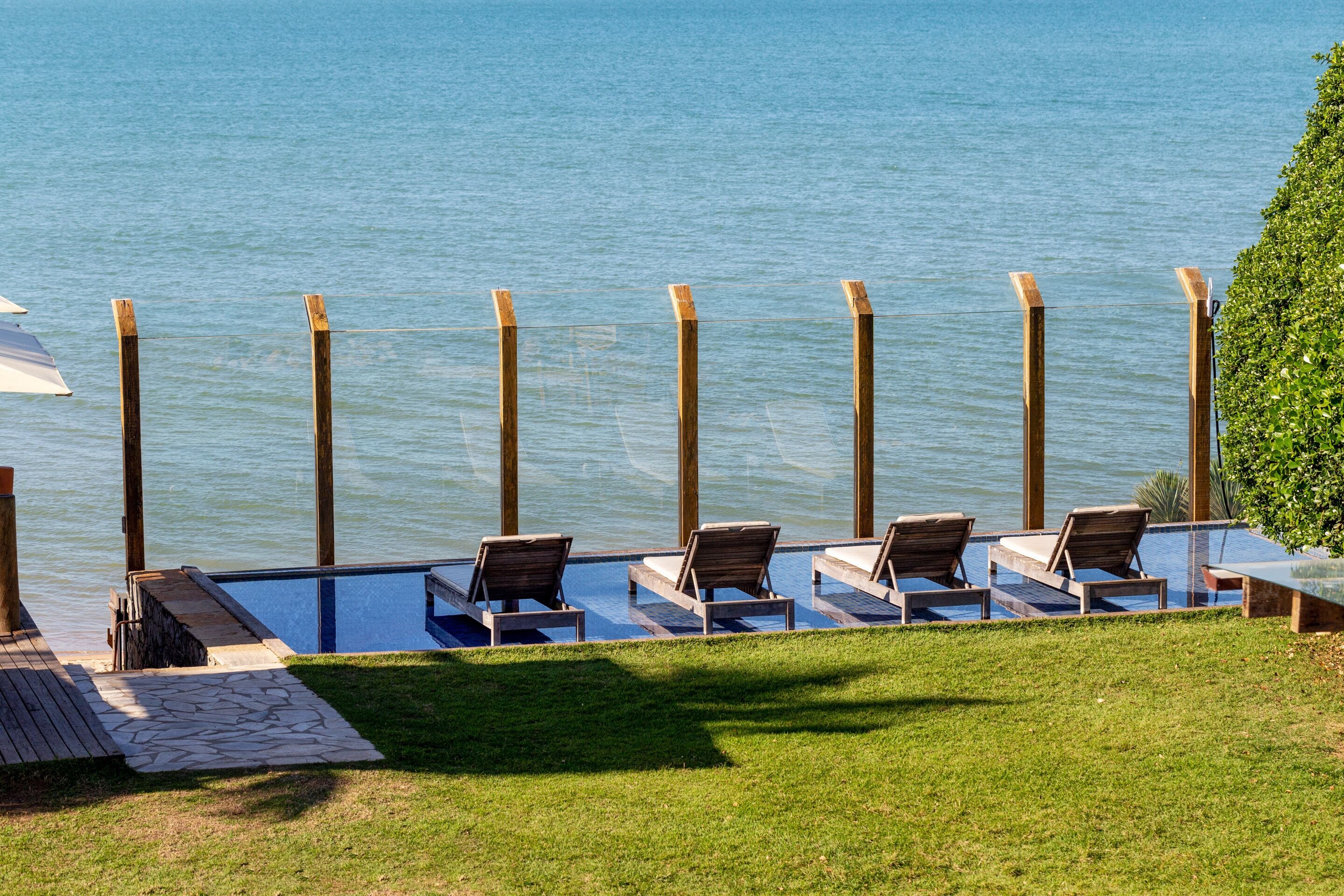on the beach, white sand, free beach cabanas, sun-loungers