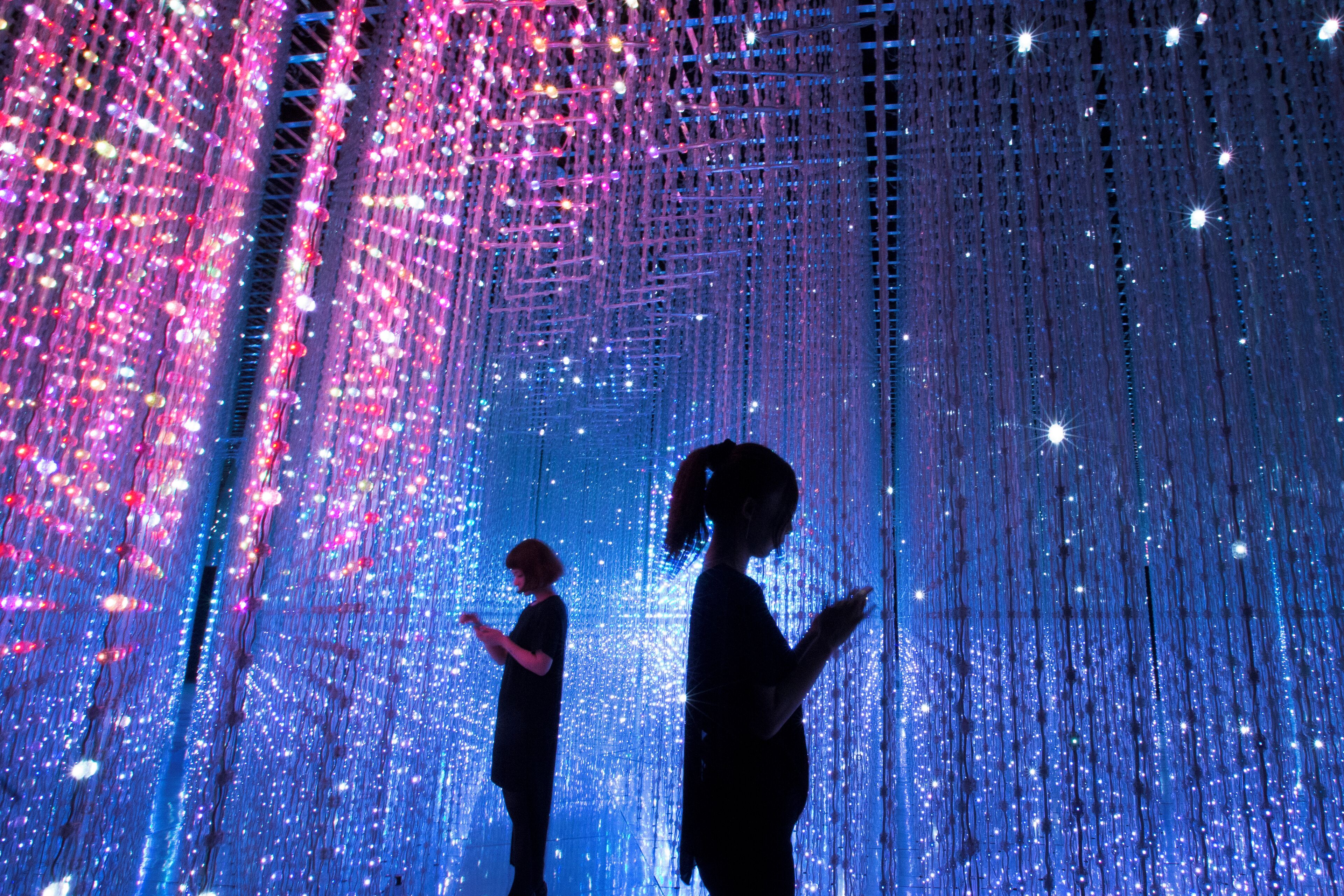 A corridor with hanging lights and a grid structure.