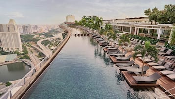 Outdoor pool, open 6:00 AM to midnight, sun loungers