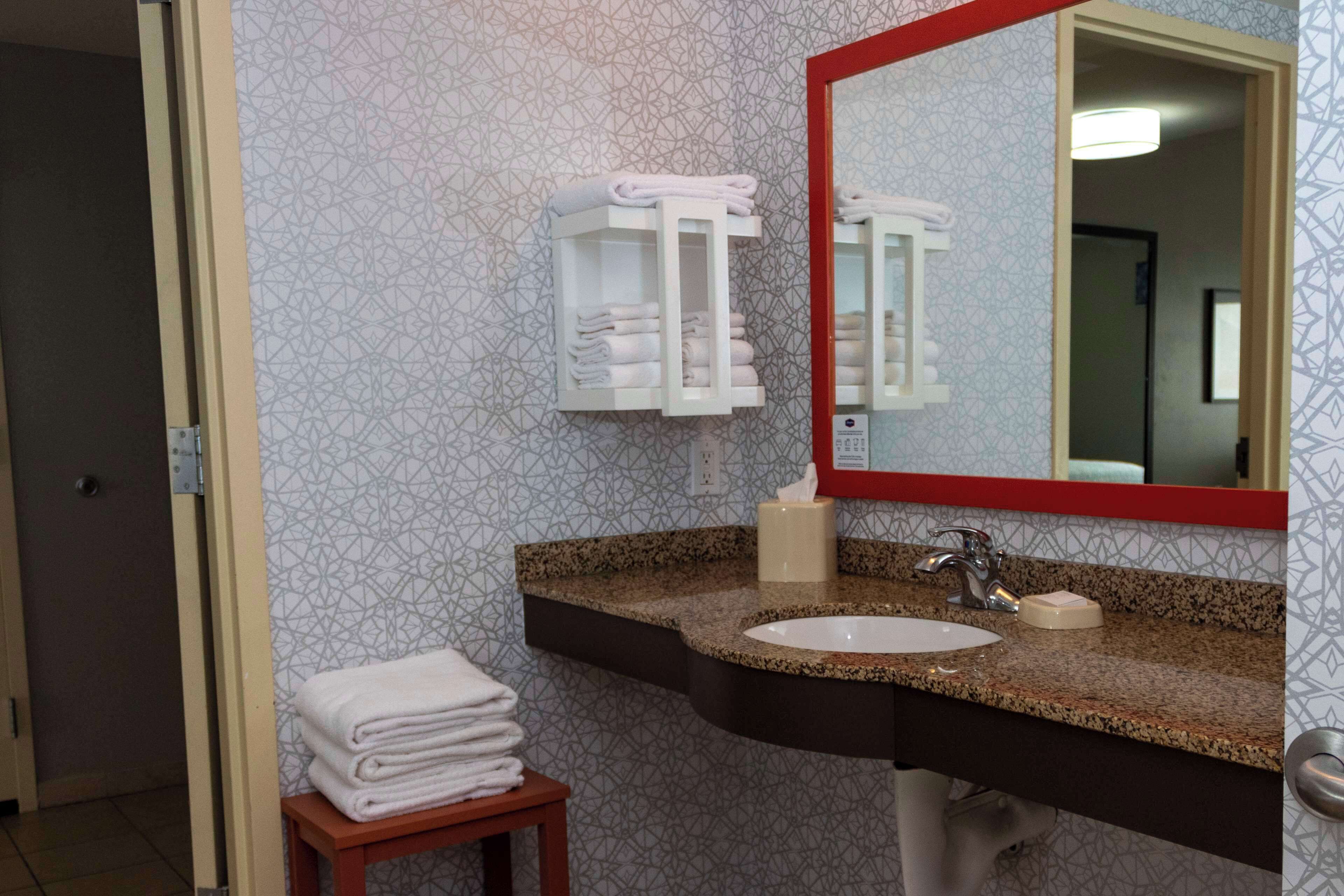 suite, one king bed, accessible | bathroom | combined shower/bathtub, hydromassage showerhead, hair dryer, towels