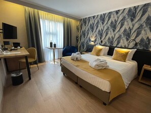 Ropa de cama de alta calidad y minibar 