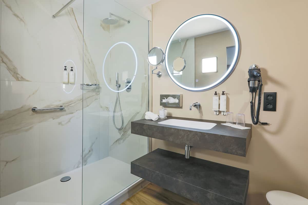 superior double room | bathroom | shower, free toiletries, hair dryer, slippers