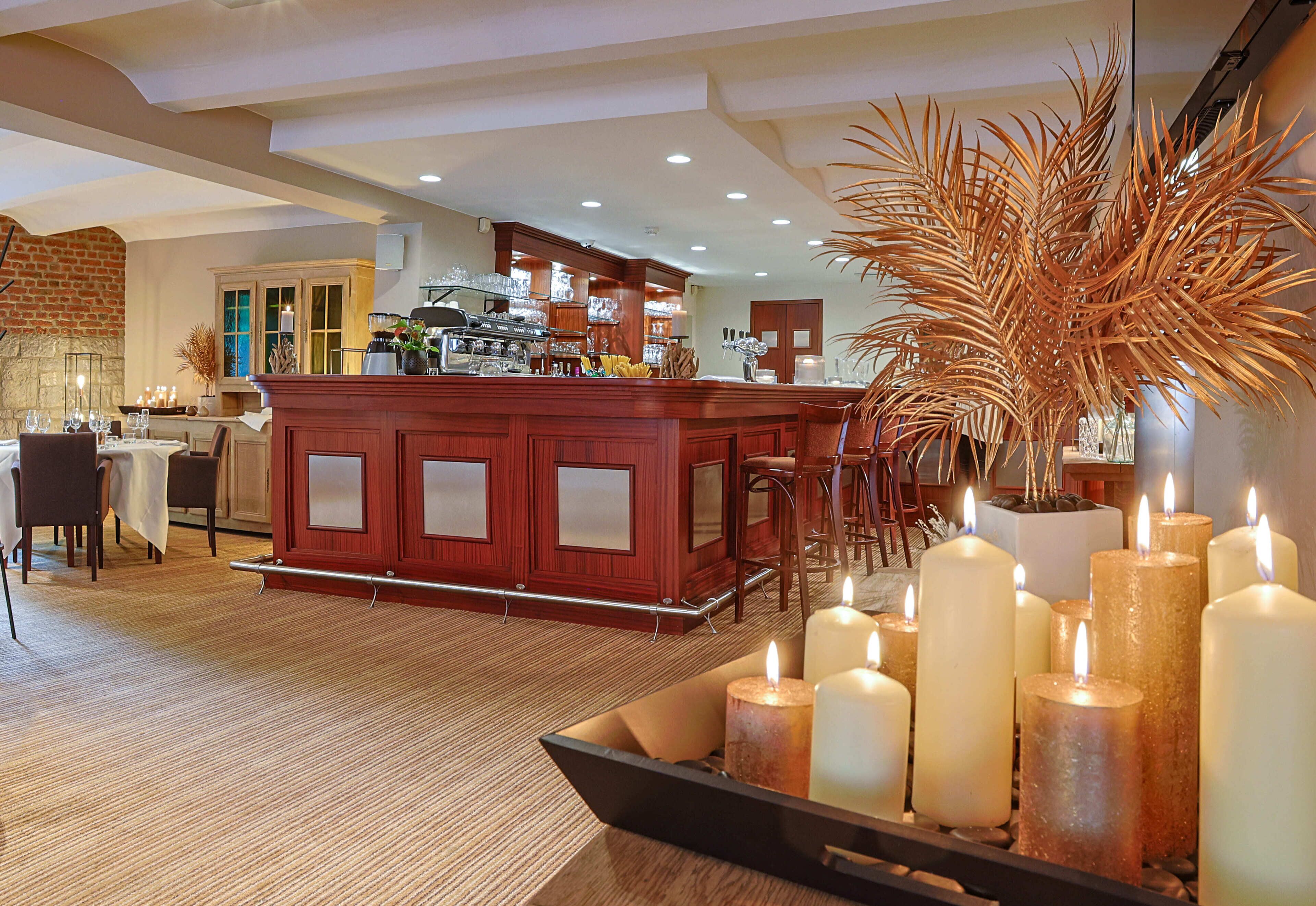 A spacious kitchen with a central island, bar area, and seating.