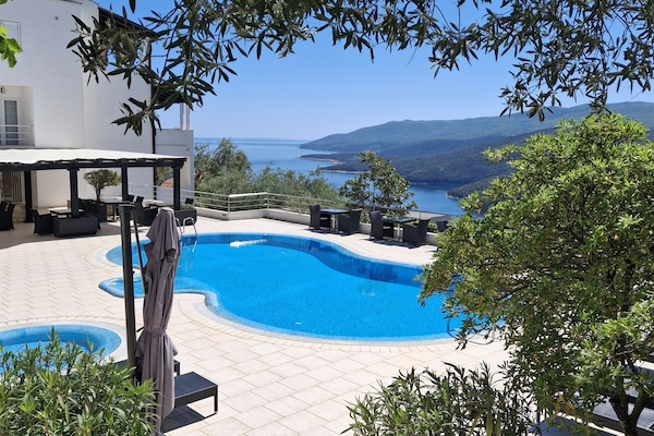 Outdoor pool, pool umbrellas, sun loungers