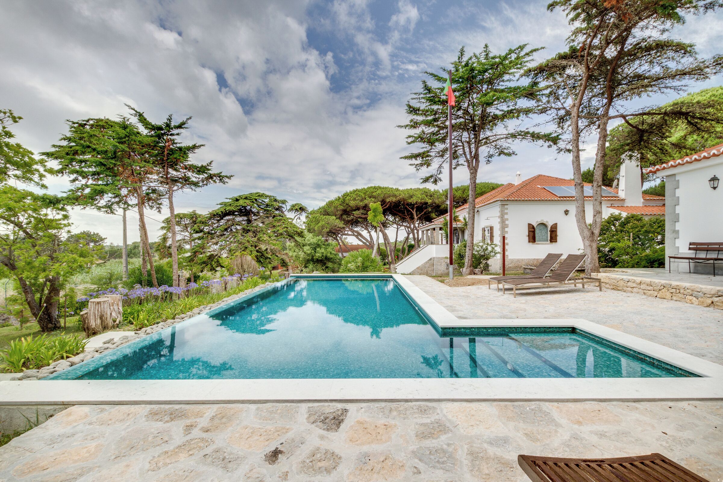 Outdoor pool, open 9:30 AM to 7:00 PM, pool umbrellas, pool loungers