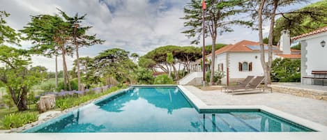 Outdoor pool, open 9:30 AM to 7:00 PM, pool umbrellas, pool loungers