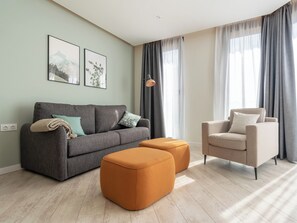 One-Bedroom Apartment | Living area | 50-inch Smart TV with cable channels, TV -  Limehome Barcelona Rector Triadó (Barcelona)