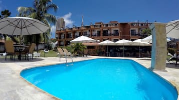 Outdoor pool, open 7 AM to 10 PM, pool loungers