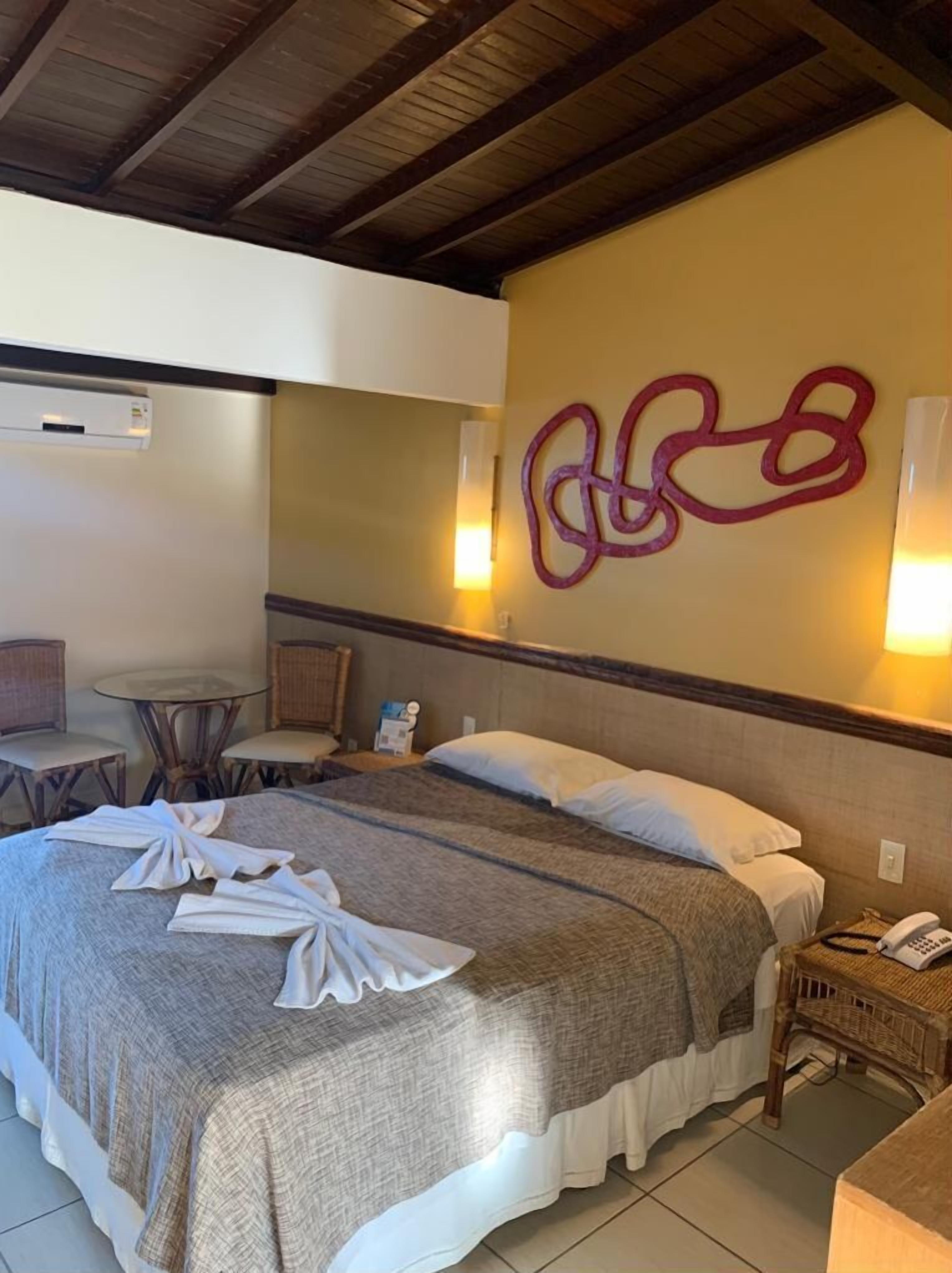 deluxe double room, sea view | minibar, in-room safe, desk, blackout curtains